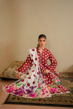 Bindiya seated with floral dupatta